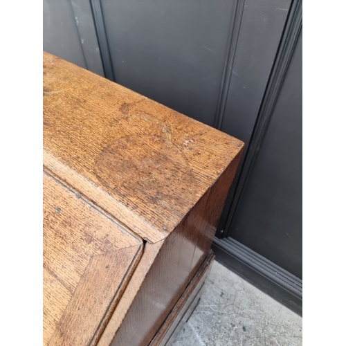 1003 - An 18th century oak bureau, in two parts, 91cm wide, (alterations).