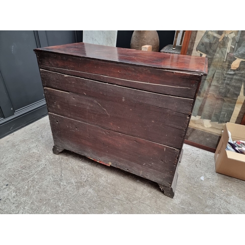 1037 - A George III mahogany chest of three short and three long graduated drawers, (on reduced bracket fee... 