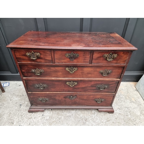 1037 - A George III mahogany chest of three short and three long graduated drawers, (on reduced bracket fee... 
