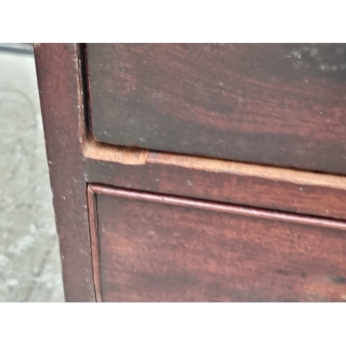 1037 - A George III mahogany chest of three short and three long graduated drawers, (on reduced bracket fee... 