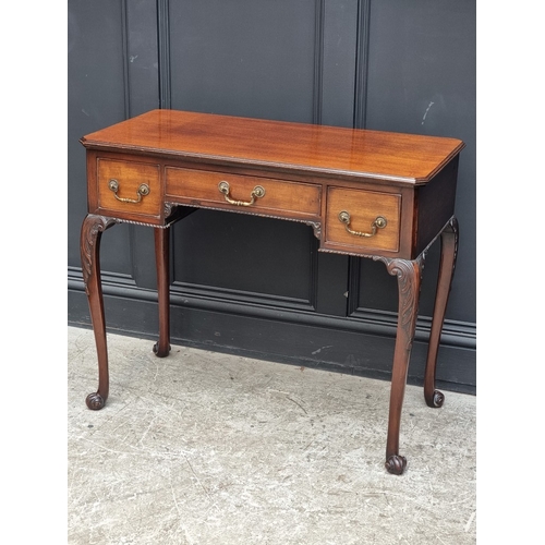 1043 - An early 20th century mahogany kneehole side table, on cabriole legs with scroll feet, 90cm wide.... 