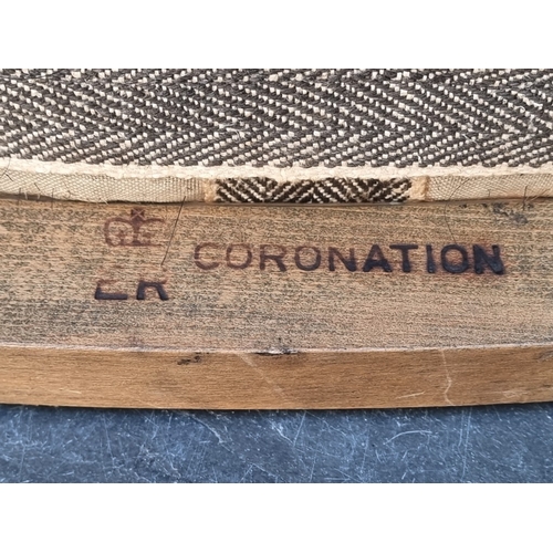 1047 - An Elizabeth II limed oak Coronation stool, with inscribed plaque, 46cm wide.