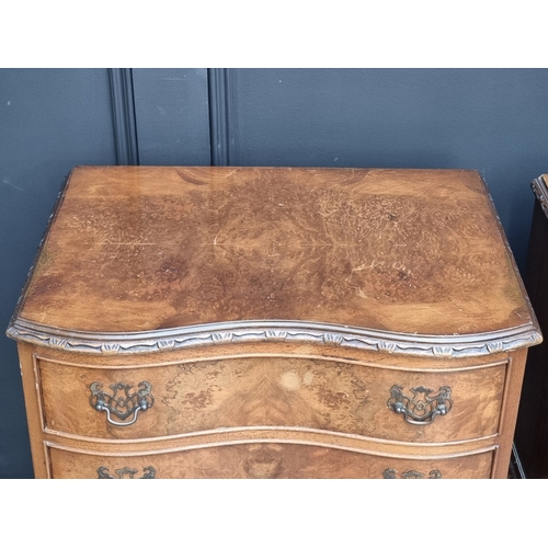 1051 - A pair of reproduction figured walnut serpentine fronted bedside chests, 52cm wide.