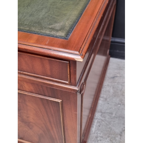 1057 - A large 'Reprodux' mahogany pedestal desk, by Bevan Funnel, 167.5cm wide.