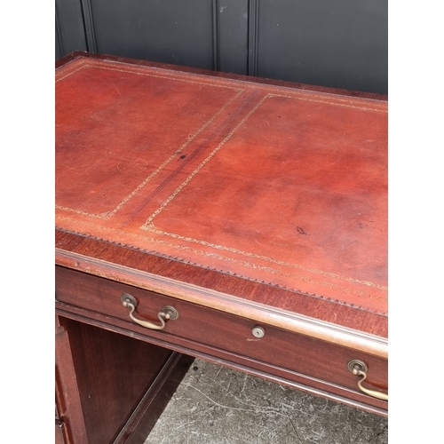 1058 - A large reproduction mahogany pedestal desk, by 'Norfolk Manor Furniture', 183.5cm wide.... 