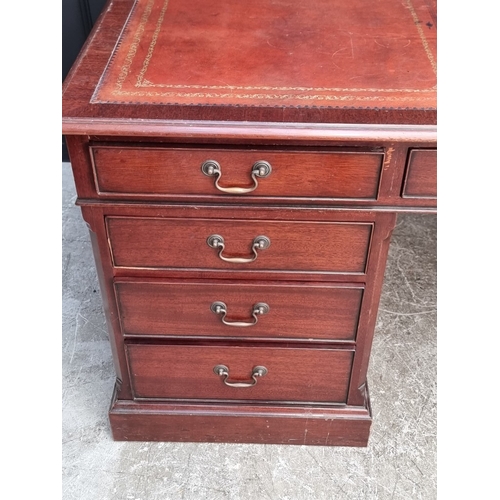 1058 - A large reproduction mahogany pedestal desk, by 'Norfolk Manor Furniture', 183.5cm wide.... 