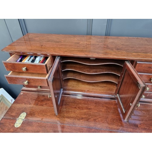 1004 - A reproduction mahogany bonheur du jour, with fold-over surface, 86cm wide.