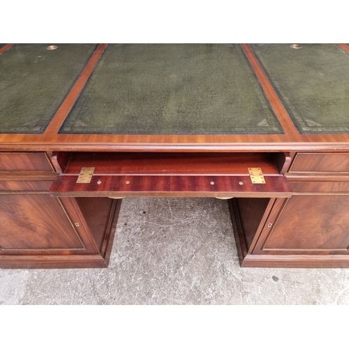 1047 - A large 'Reprodux' mahogany pedestal desk, by Bevan Funnel, 167.5cm wide.