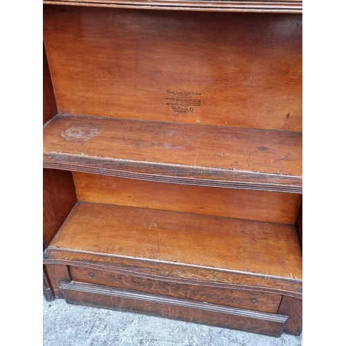 1005 - An unusual early 20th century oak 'Wernicke System Elastic Bookcase', 141cm high x 90.5cm wide.... 