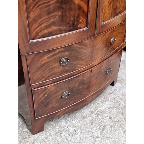 1006 - A small 1920s mahogany bowfront wardrobe, 92.5cm wide.