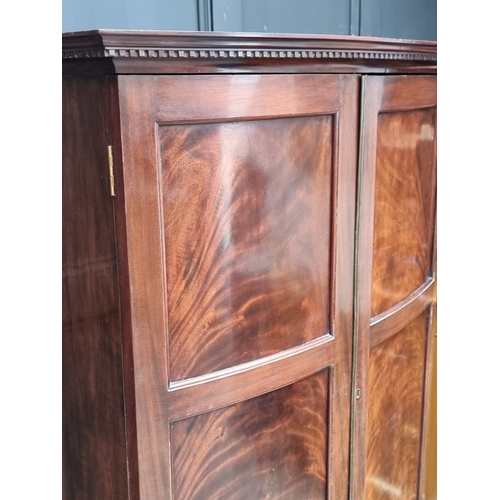1006 - A small 1920s mahogany bowfront wardrobe, 92.5cm wide.