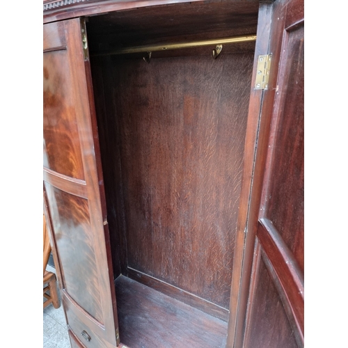 1006 - A small 1920s mahogany bowfront wardrobe, 92.5cm wide.