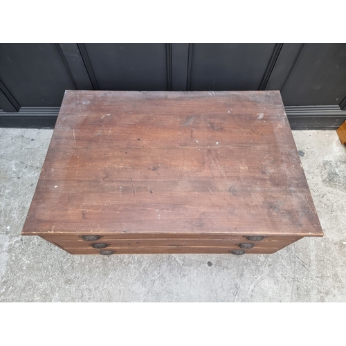 1014 - Two old plan chests, 123cm wide, (missing drawer front is now present). (2)