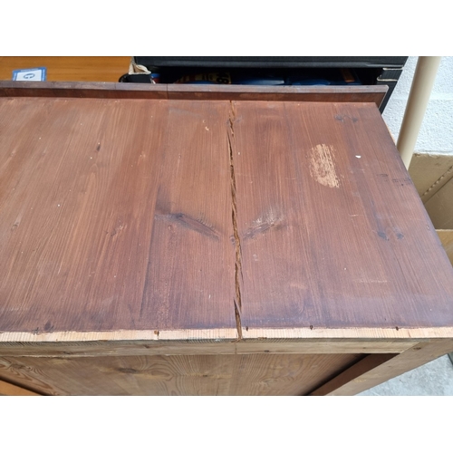 1014 - Two old plan chests, 123cm wide, (missing drawer front is now present). (2)