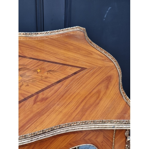 1019 - A Louis XV style tulipwood, marquetry and gilt brass trolley, 91cm wide.