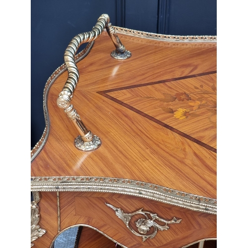 1019 - A Louis XV style tulipwood, marquetry and gilt brass trolley, 91cm wide.