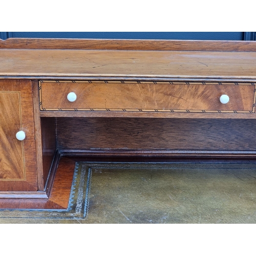 1023 - A reproduction mahogany and chequer banded serpentine fronted bonheur du jour, circa 1940, with ivor... 