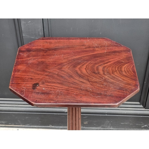 1024 - A pair of Regency style mahogany octagonal tripod tables, 74cm high x 39.5cm wide.
