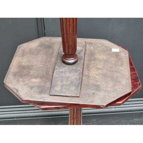 1024 - A pair of Regency style mahogany octagonal tripod tables, 74cm high x 39.5cm wide.