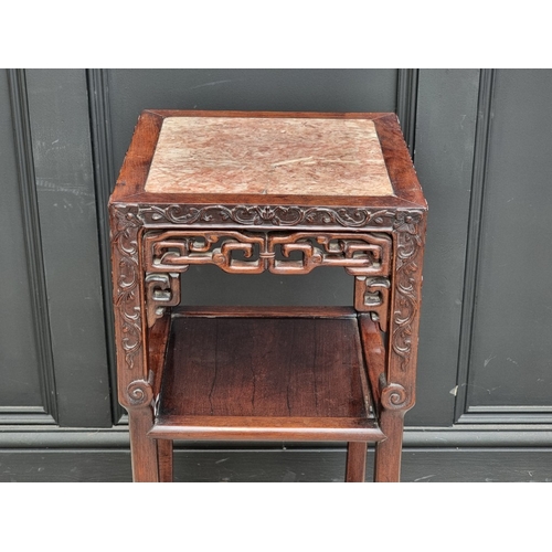 1026 - A Chinese carved hardwood and marble two-tier jardini&egrave;re stand, 80.5cm x 34.5cm, (marble crac... 