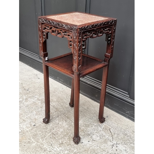 1026 - A Chinese carved hardwood and marble two-tier jardini&egrave;re stand, 80.5cm x 34.5cm, (marble crac... 