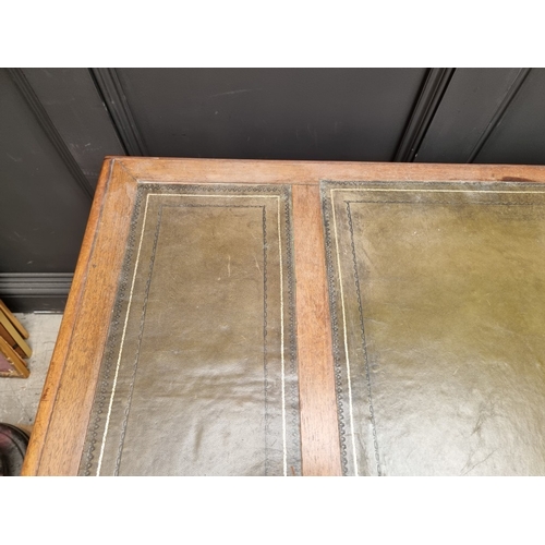 1028 - A Victorian rosewood desk, on reeded turned supports and joined by a central stretcher, 121cm wide, ... 