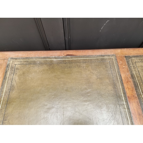 1028 - A Victorian rosewood desk, on reeded turned supports and joined by a central stretcher, 121cm wide, ... 