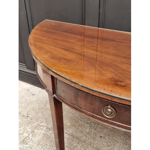 1029 - A 19th century mahogany single drawer demi-lune console table, 122cm wide.