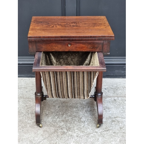 1031 - A Victorian rosewood work table, with fold-over card table surface, 53.5cm wide.