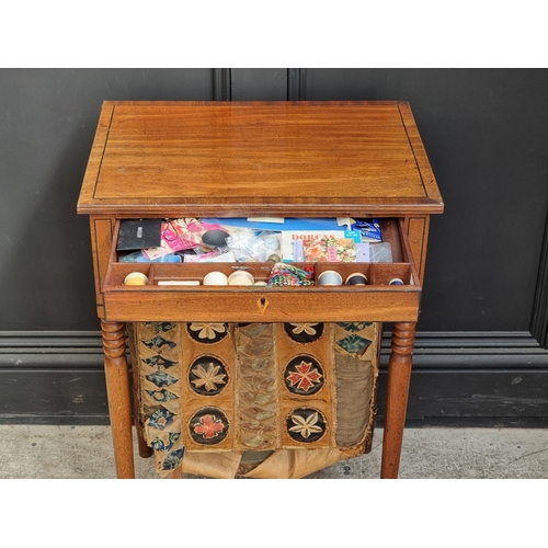 1032 - A Regency mahogany and ebony strung work table, 49.5cm wide.