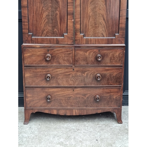 1048 - A George III mahogany linen press, now enclosing hanging space, 121cm wide.