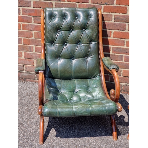 1056 - A pair of mahogany and buttoned green leather slipper chairs.