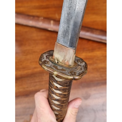 20 - A Japanese wakizashi and scabbard, with WWII mounts, 53cm blade, overall length 82cm.... 
