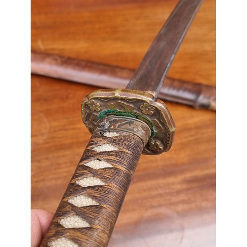 20 - A Japanese wakizashi and scabbard, with WWII mounts, 53cm blade, overall length 82cm.... 