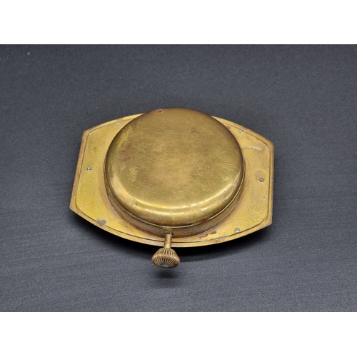 11 - A 1930s brass dashboard timepeice, 8.5cm wide.