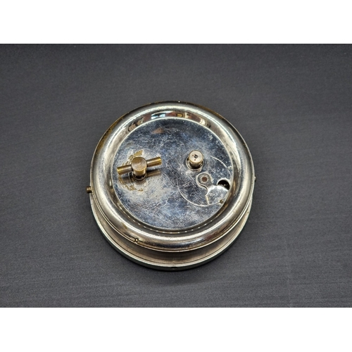 14 - A vintage nickel plated 8 day car clock, 9.5cm diameter.