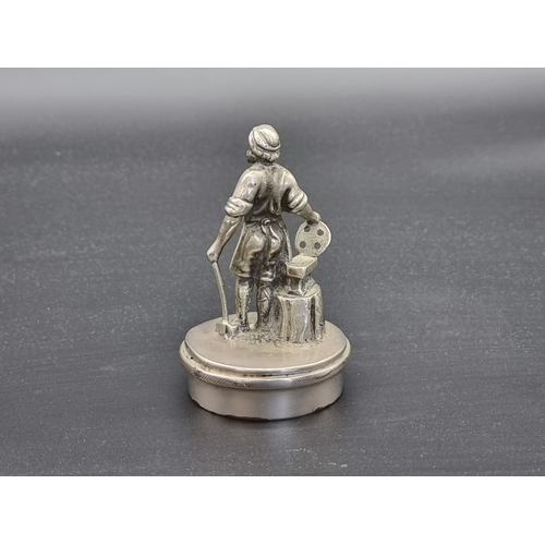 17 - A vintage nickel plated Blacksmith car mascot, 11cm high.
