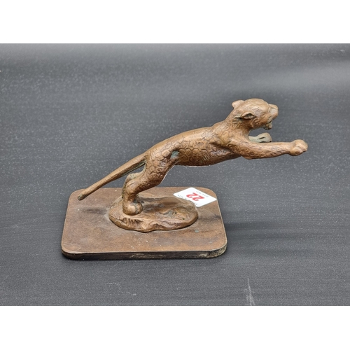 22 - A vintage SS Jaguar Leaping Cat car mascot, 10cm high, on square base.