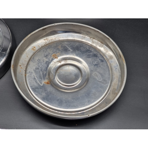 34 - A set of four Ford Escort Mk.I hubcaps, 24cm diameter.