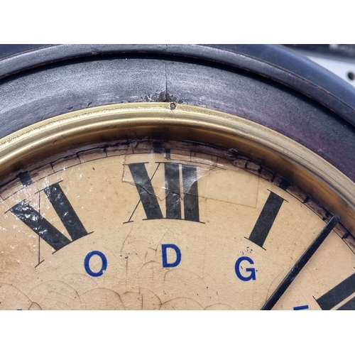 41 - A small early 20th century Continental wall clock, the 8in dial inscribed 'Lodge Plugs Sold Here', w... 