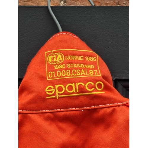 44 - A Sparco 'Tim Harvey' race suit, signed.