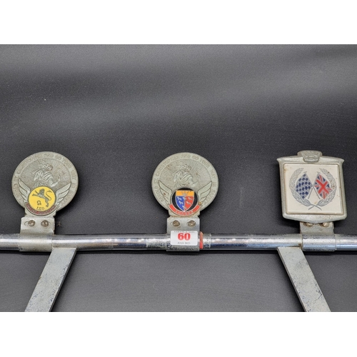 60 - A vintage chrome plated badge bar, 61cm wide.