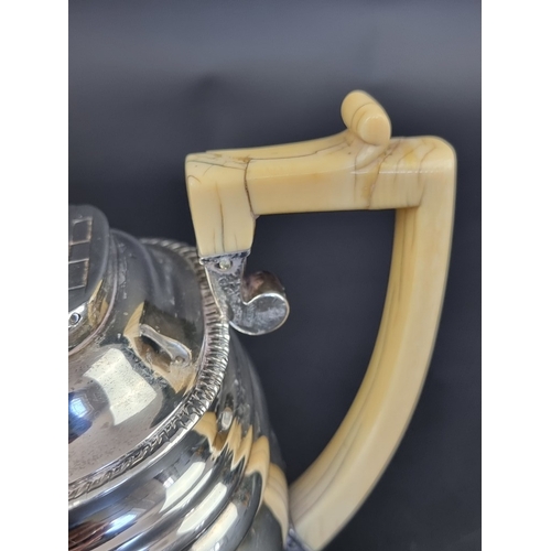 204 - A George III silver teapot, having ivory handle and knob, by W F, London 1815, height to handle 16cm... 