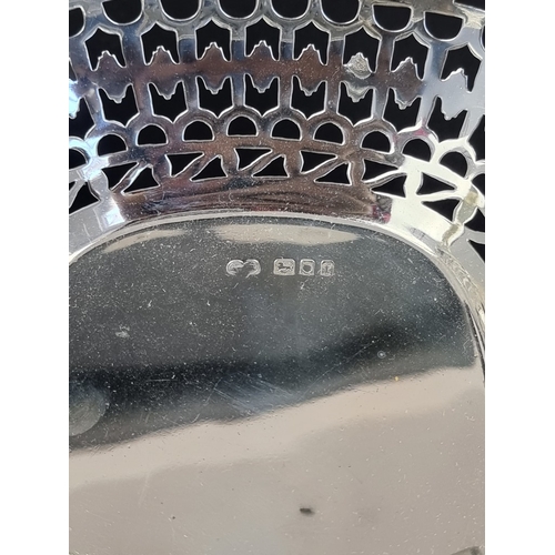 214 - A pierced silver basket, by Goldsmiths & Silversmith, London 1921, height to handle 17cm, 336g.... 