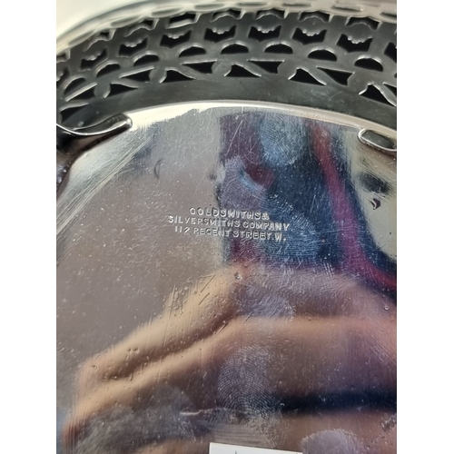 214 - A pierced silver basket, by Goldsmiths & Silversmith, London 1921, height to handle 17cm, 336g.... 