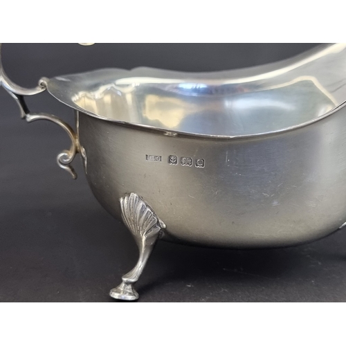 215 - A silver sauce boat, by I S Greenberg & Co, Birmingham 1927, height to handle 9cm, 196g.... 