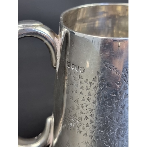 229 - A Victorian silver mug, maker's mark rubbed, London 1884, 10.5cm high, 197g.