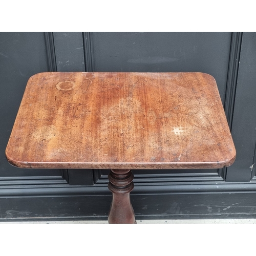 1002 - A George III mahogany tripod table, with fixed top, 56.5cm wide.