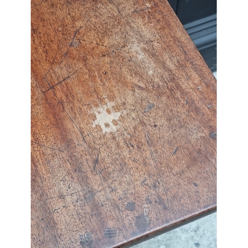 1002 - A George III mahogany tripod table, with fixed top, 56.5cm wide.