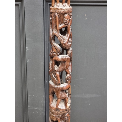 1003 - Ethnographica: a carved hardwood standard lamp, 155cm high.